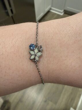COACH Delicate Silver Flower Charm Bracelet with Blue Accent